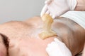 Epilation chest of young male Royalty Free Stock Photo