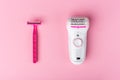 Epilator and razor for woman depilation on pink background
