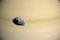 Epimetheus orbiting around Saturn planet. 3d render