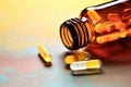 epipen lying on a amber colored pharmaceutical pill bottle Royalty Free Stock Photo