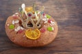 Epiphany cake, Kings cake, Roscon de reyes or Rosca de reyes on wooden table
