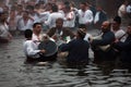 Epiphany Traditions - Jordan. Men dance in the icy waters of the river Tunja on January 6, 2011, Kalofer, Bulgaria