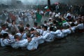 Epiphany Traditions - Jordan. Men dance in the icy waters of the river Tunja on January 6, 2011, Kalofer, Bulgaria