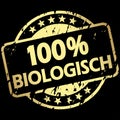 gold grunge stamp with Banner 100% biological (in german Royalty Free Stock Photo