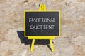 EQ emotional quotient symbol. Concept words EQ emotional quotient on black chalk blackboard on a beautiful stone background.