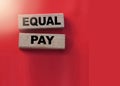 Equal pay words on wooden blocks. No Income differences concept