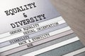 Equality and Diversity gender sexual orientation ethnicity disability age words on pages of copybook . Social concept