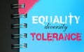 Equality Diversity Tolerance words on page of spiral notebook. Social concept