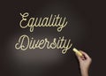 Equality Diversity word diversity is written in chalk on a blackboard. Gender and ethnical equality social concept