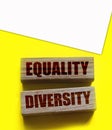 Equality diversity words written on wood blocks. ETolerance inclusion social and business concept