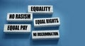 Equality no rasism equal pay and rights words on wooden blocks. Business and Social equal opportunities concept Royalty Free Stock Photo