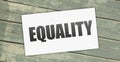 Equality word on card on grunge wooden background. social diversity Concept