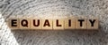 Equality Word on Wooden Cubes put on crochet carpet. Gender and race equality, Tolerance for other religion or sexual orientation
