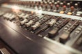 Equalizer adjusting Sound recording studio mixing desk.