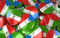 Equatorial Guinea Badges Background - Pile of guinean Flag Buttons.