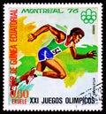 EQUATORIAL GUINEA - CIRCA 1976: A postage stamp from Guinea showing Atletismo at XXI Olympic Games in Montreal Royalty Free Stock Photo