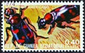 EQUATORIAL GUINEA - CIRCA 1978: A stamp printed in Equatorial Guinea from the `Insects` issue shows Nicrophorus americanus Royalty Free Stock Photo