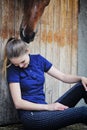 Equestrian girl and horse in stable Royalty Free Stock Photo