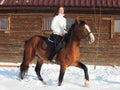 Equestrian girl ride her horse at winter morning Royalty Free Stock Photo