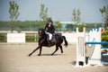 Equestrian Horse Rider Jumping.Picture showing a competitor performing in show jumping competition Royalty Free Stock Photo