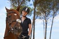 Equestrian, portrait and riding a horse in nature on adventure, journey and happiness in countryside. Ranch, animal and Royalty Free Stock Photo