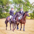 Equestrian sport dressage, walkthrough - two young girls in jockey clothes are sitting on a horse Royalty Free Stock Photo