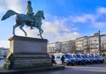 Equestrian statue of Duke Friedrich Wilhelm on the palace square with a row of police vans in front of it