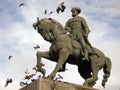 Equestrian statue with flying pigeons Royalty Free Stock Photo