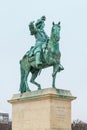 Equestrian statue of Louis XIV on Place d`Armes in front of Palace of Versailles. Palace Versailles was a royal chateau Royalty Free Stock Photo