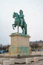 Equestrian statue of Louis XIV on Place d`Armes in front of Palace of Versailles. Palace Versailles was a royal chateau Royalty Free Stock Photo