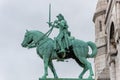 Equestrian statue of of Saint Joan of Arc at the Basilica of the Sacred Heart of Paris, at the summit of the butte Montmartre, the Royalty Free Stock Photo