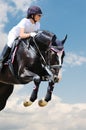 Equestrianism: Young girl in jumping show Royalty Free Stock Photo