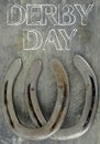 Equine them with old, worn horseshoes on a scratched and damaged steel background. Lots of texture with copy space.