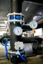 The equipment of the boiler-house, valves, tubes, pressure gauges, thermometer. Close up of manometer, pipe, flow meter, water