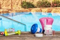 Equipment with chemical cleaning products and tools for the maintenance of the swimming pool. Royalty Free Stock Photo