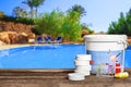 Equipment with chemical cleaning products and tools for the maintenance of the swimming pool. Royalty Free Stock Photo