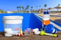 Equipment with chemical cleaning products and tools for the maintenance of the swimming pool. Royalty Free Stock Photo