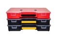 Equipment of craftsman. Three professional plastic storage boxes for screws, bolts, dowels and some other components isolated on a