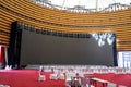 Equipment dining table and big screen in large indoor banquet hall Royalty Free Stock Photo