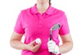 Equipment for golf on the background of a pink Polo T-shirts