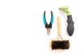 Equipment for grooming pets. clipper, furminator and brush on white background with copy space