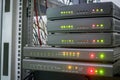 Equipment for Internet connection works in computer racks. Several digital communication gateways are in the server room. Royalty Free Stock Photo