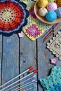 Equipment for knitting and crochet hook, colorful rainbow cotton yarn, ball of threads, wool, knitted elements, napkin . Granny Royalty Free Stock Photo