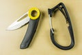 Equipment for the mountaineer. Rope knife and carabiner from Petzl. Royalty Free Stock Photo
