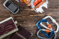 Equipment for mountaineering and hiking on wooden background. Royalty Free Stock Photo