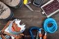 Equipment for mountaineering and hiking on wooden background. Royalty Free Stock Photo