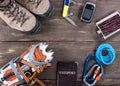 Equipment for mountaineering and hiking on wooden background. Royalty Free Stock Photo