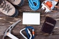 Equipment for mountaineering and hiking on wooden background. Royalty Free Stock Photo