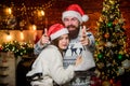 Equipment outdoor sport. Active winter. Winter sports. Happy couple with figure skates. Bearded man and Santa girl