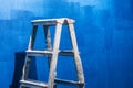 Equipment, after painting the walls of a room. Blue wall. Work at home. Detail of a staircase, in the room. Blue shades